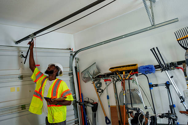 Professional Garage Door Panel Replacement technician working in DeWitt, IA